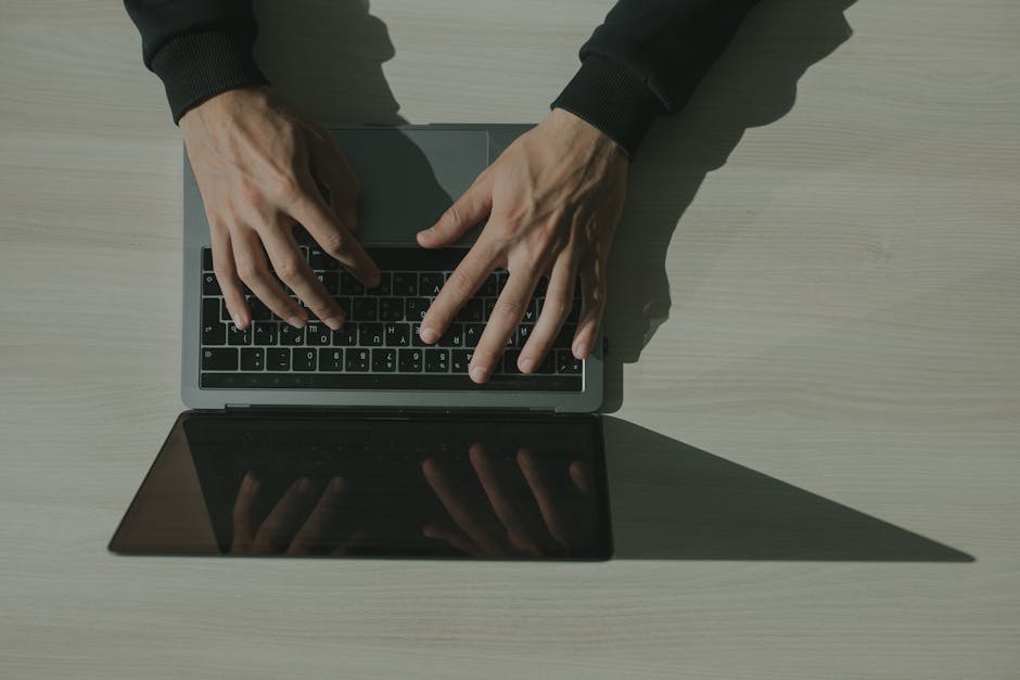 Employee reviewing a suspicious email on their laptop screen